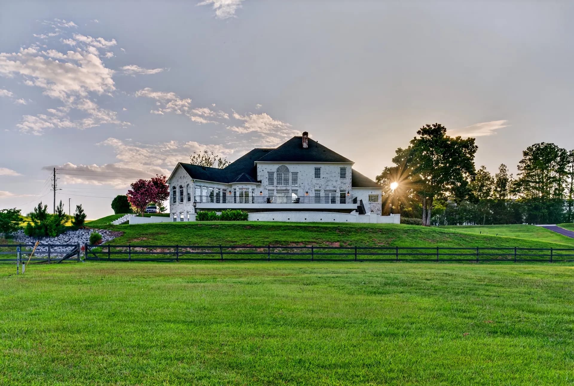 Rear exterior sunset at White Fallow Estate