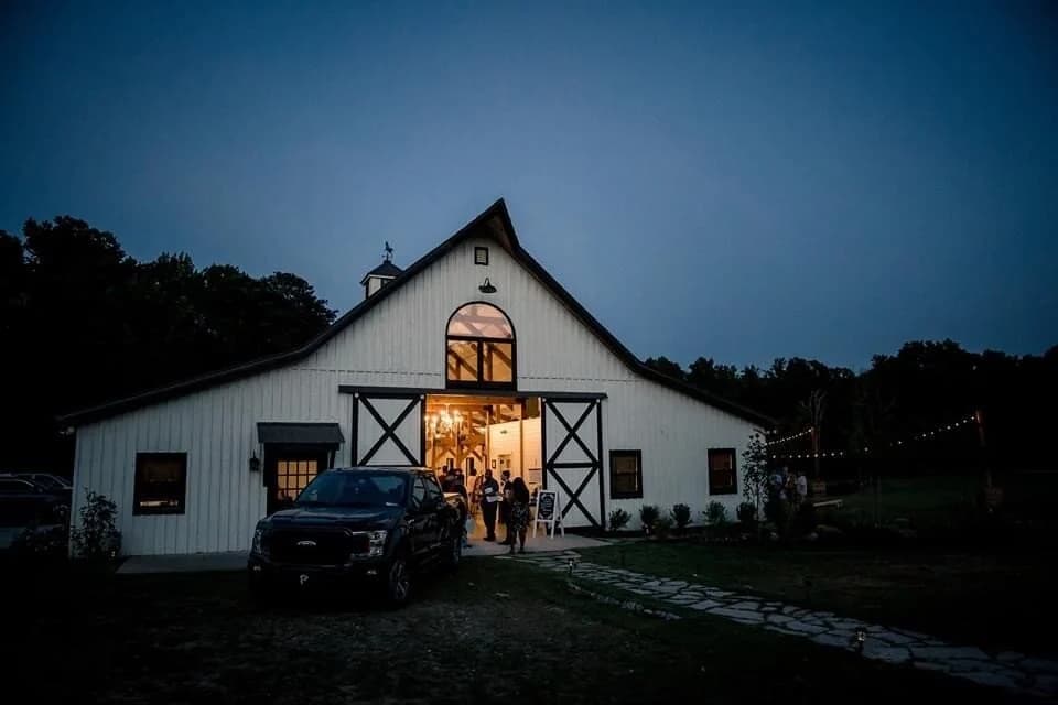 Barn twilight guests arriving at White Fallow Estate