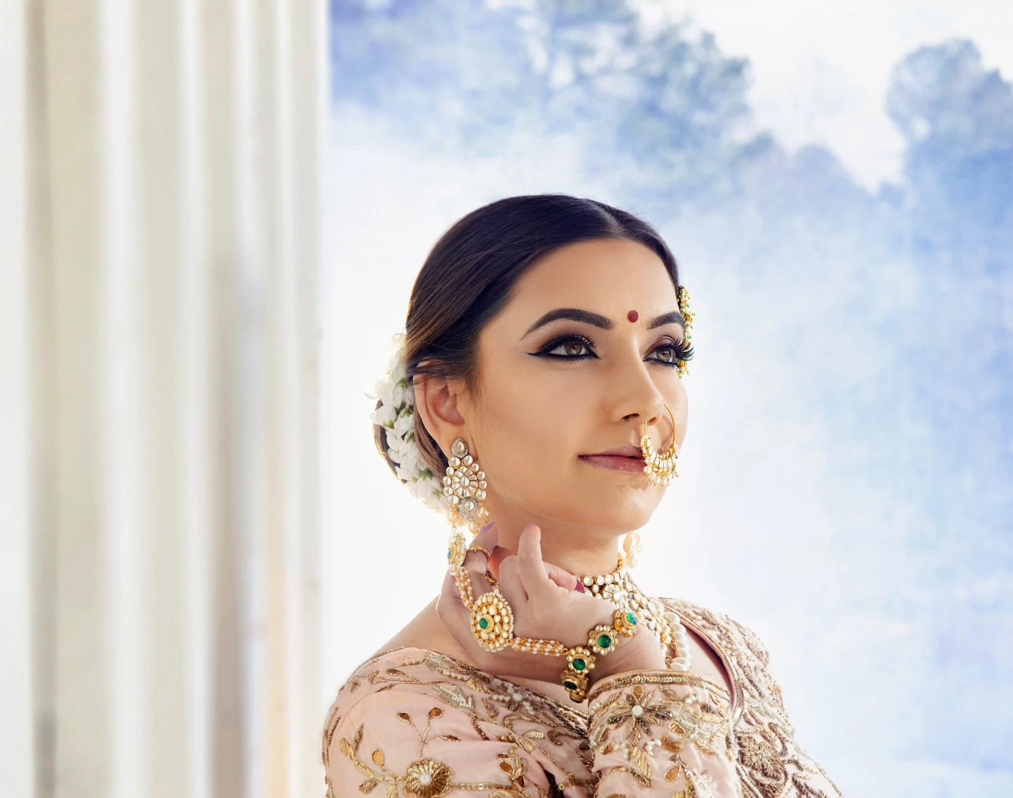 A bride in traditional South Asian bridal jewellery